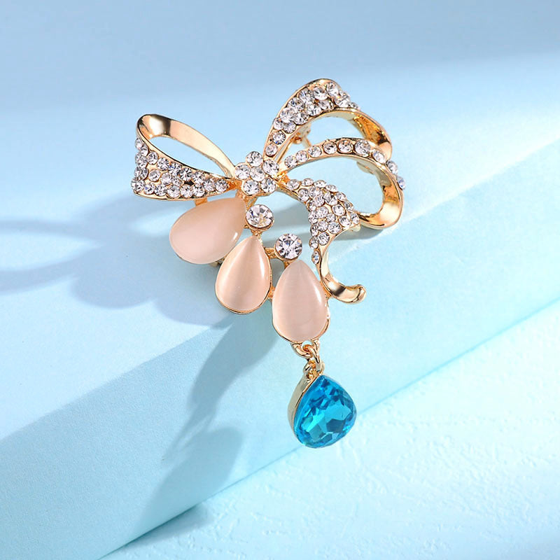 Fashion Bowknot Cat's Eye Brooch with Crystal Pin